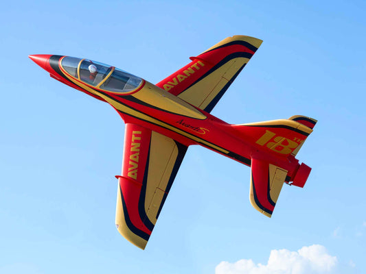 FMS 90mm EDF Avanti Jet in flight against a blue sky.