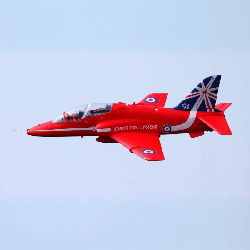 Red RC Hawk jet model featuring Union Jack tail design in flight