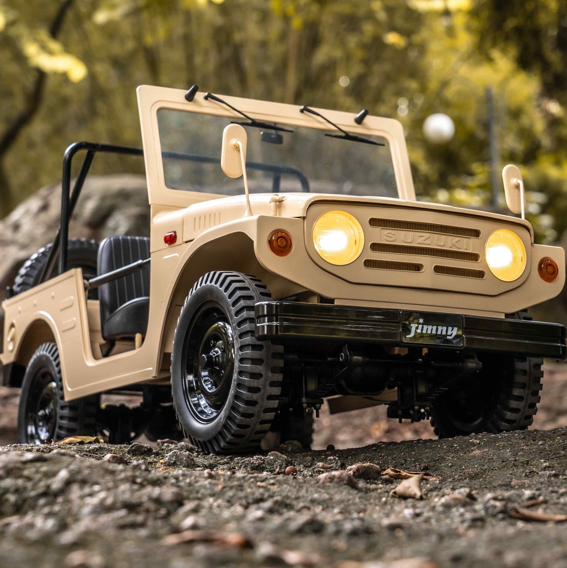 Beige SUZUKI Jimny LJ10 scale model with headlights and outdoor background